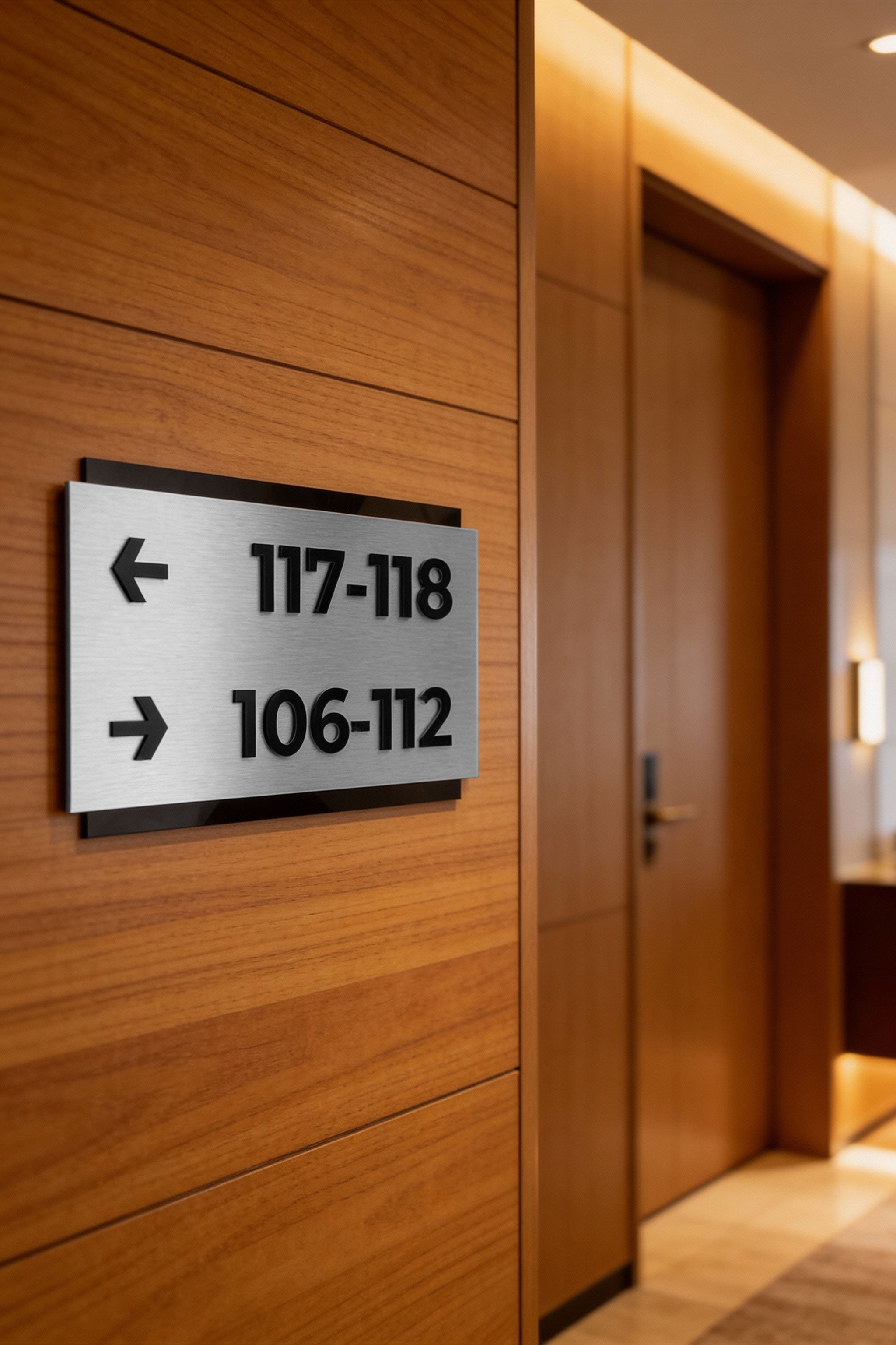 ALUMADESIGNCO custom directional sign in Modern Design with brushed silver plaque and black acrylic text, premium wayfinding signage for offices, hotels, apartments, and commercial interiors