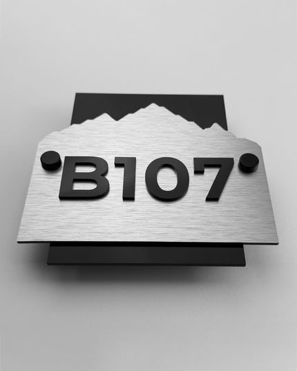 ALUMADESIGNCO brushed silver and black acrylic custom hotel room number plaque Alpine Design with minimalist modern style, elegant wall signage for hotels and apartments