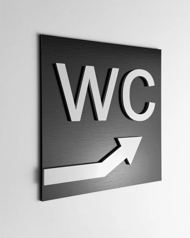 ALUMADESIGNCO WC signage with upstairs arrow, premium restroom wayfinding sign for offices, hotels, cafés, and commercial interiors
