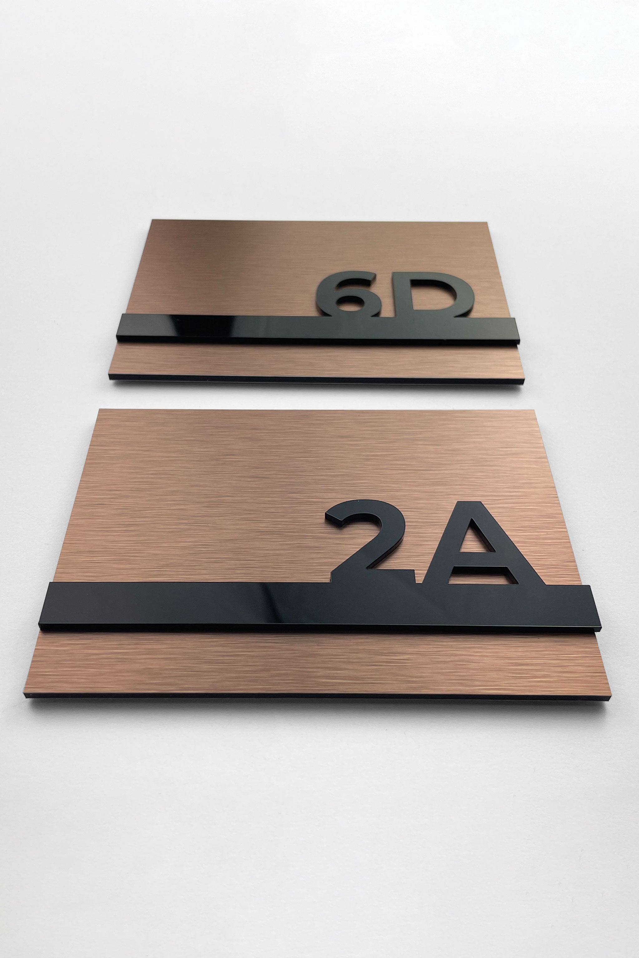 3D acrylic room number sign Horizon Design by ALUMADESIGNCO featuring raised numbers, modern door plaque for hotel rooms and apartment interiors