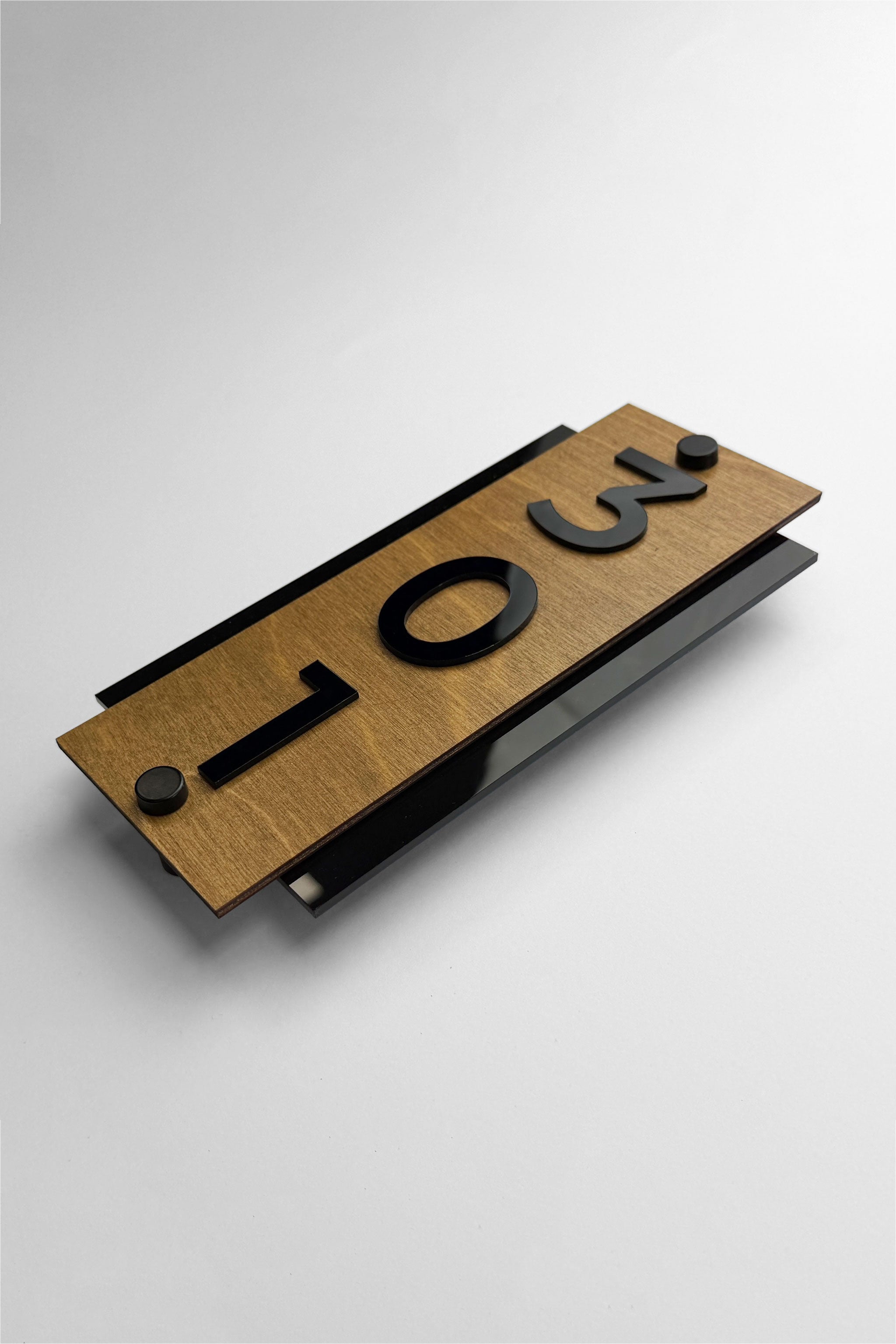 ALUMADESIGNCO vertical wood and acrylic hotel room number plaque with steel standoff hardware and raised black acrylic numbers, modern signage solution for hotels and offices