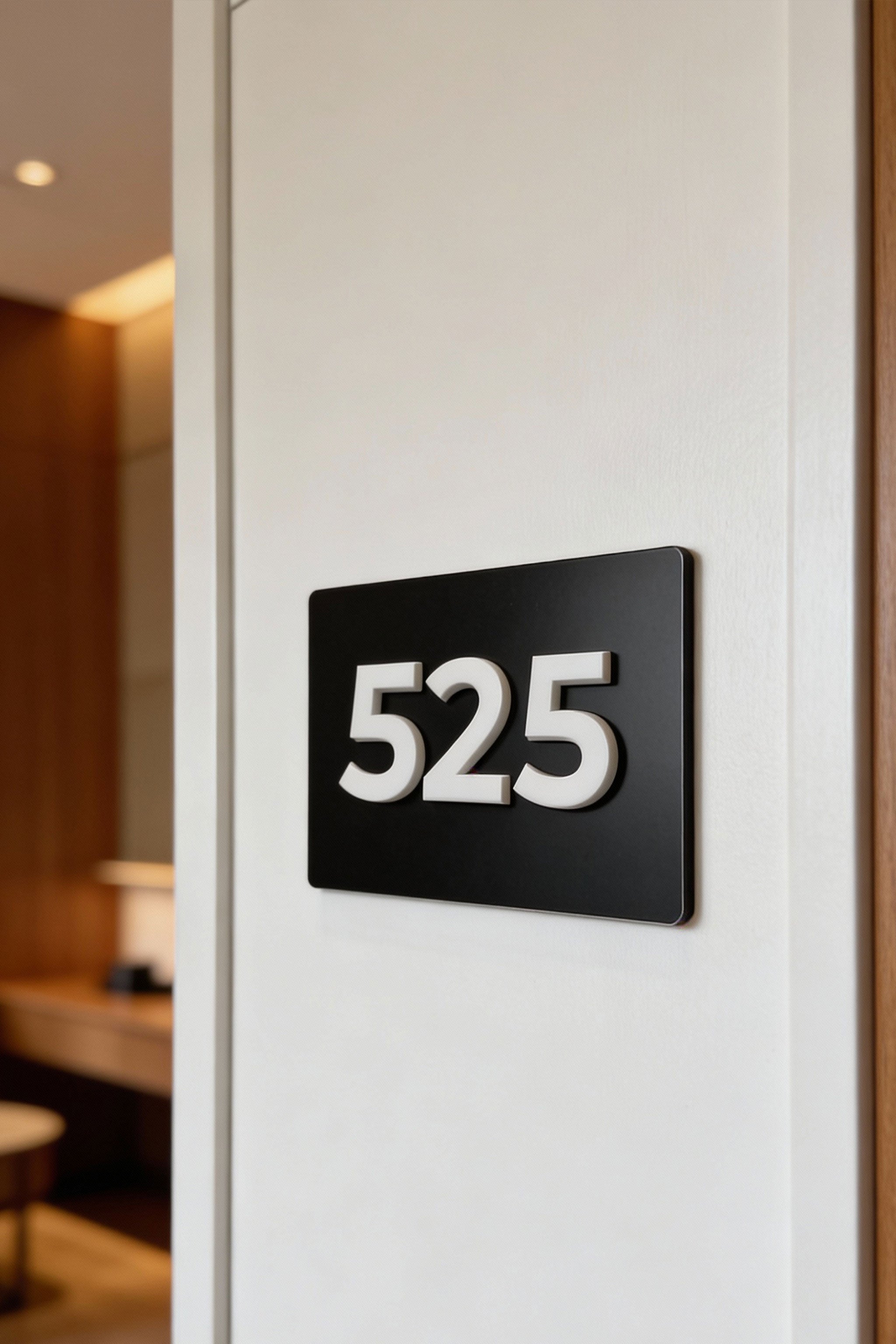ALUMADESIGNCO custom room number sign with black metal plaque and white acrylic numbers, modern door signage for hotels, apartments, Airbnb properties, and offices