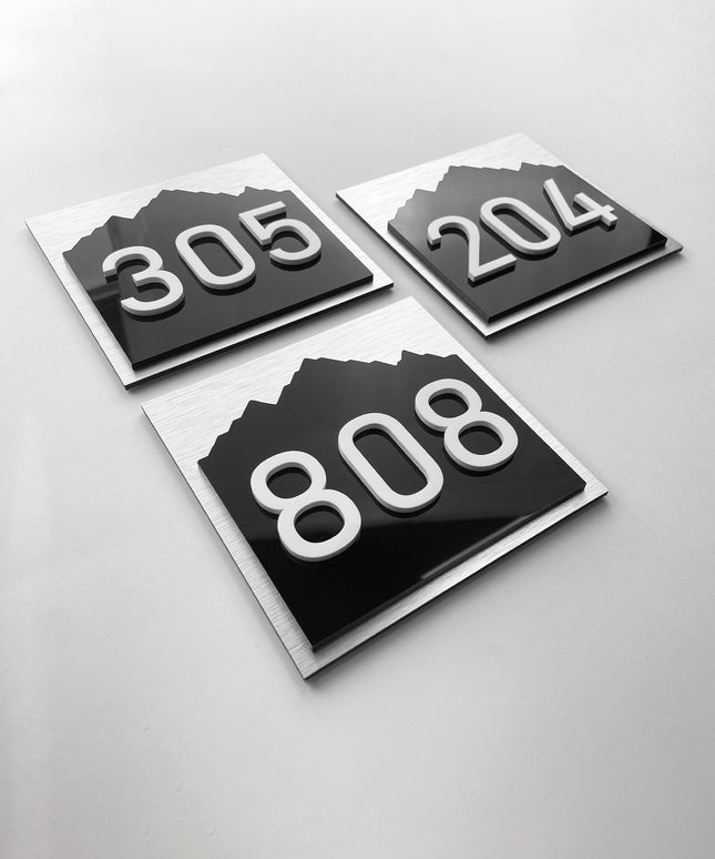 Interior 3D room number sign Alpine Design by ALUMADESIGNCO featuring raised acrylic numbers and minimalist style, modern signage for hotel rooms and apartment doors