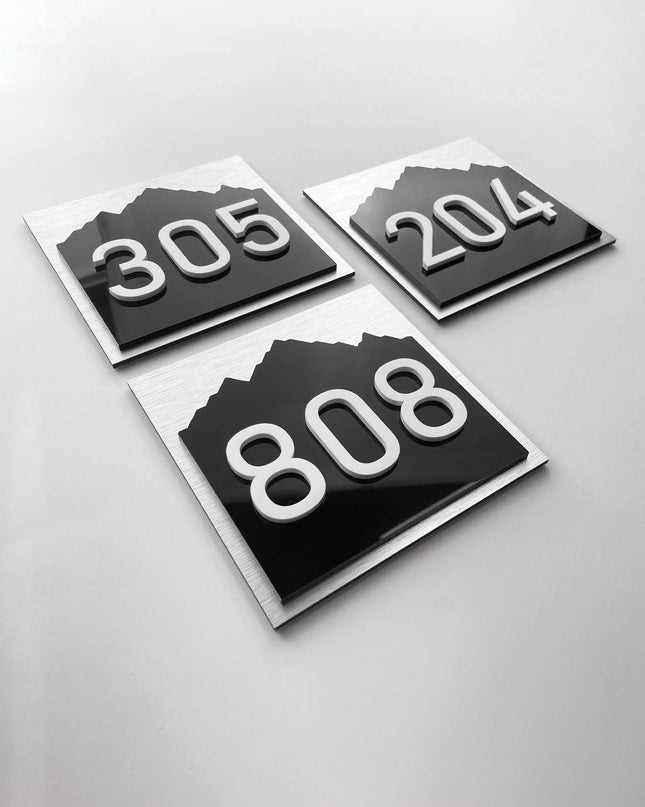 Interior 3D room number sign Alpine Design by ALUMADESIGNCO featuring raised acrylic numbers and minimalist style, modern signage for hotel rooms and apartment doors