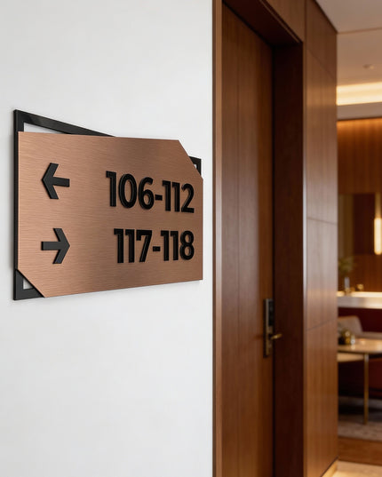 ALUMADESIGNCO brushed bronze directional wall sign with black acrylic lettering, premium wayfinding signage for offices, hotels, Airbnb properties, and public interiors