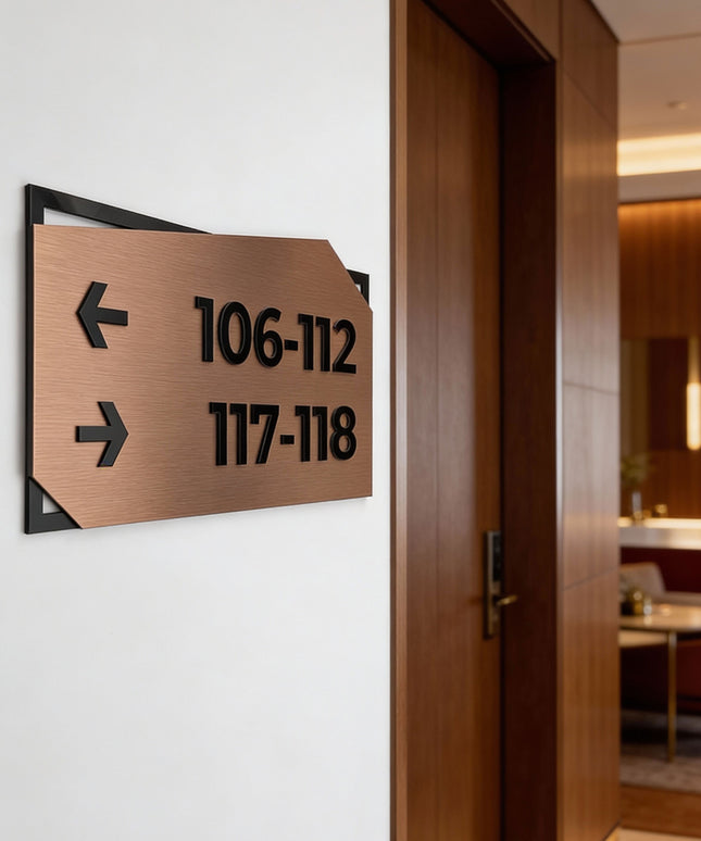 ALUMADESIGNCO brushed bronze directional wall sign with black acrylic lettering, premium wayfinding signage for offices, hotels, Airbnb properties, and public interiors