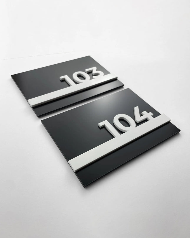 Black metal and white acrylic hotel room number sign by ALUMADESIGNCO, modern door plaque for hotel corridors and contemporary interiors
