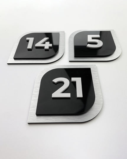 3D hotel door number plate by ALUMADESIGNCO featuring raised acrylic numbers, modern interior signage for hotel rooms and apartment doors