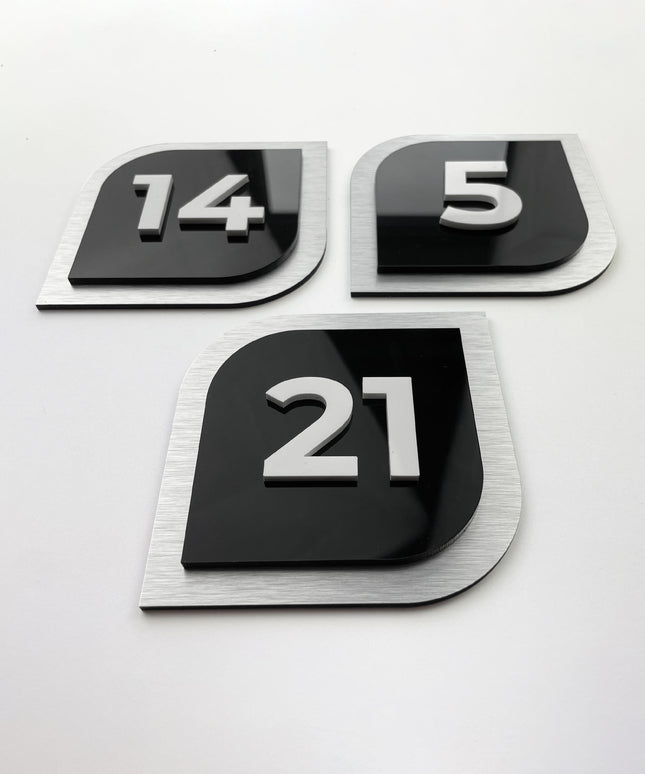 3D hotel door number plate by ALUMADESIGNCO featuring raised acrylic numbers, modern interior signage for hotel rooms and apartment doors