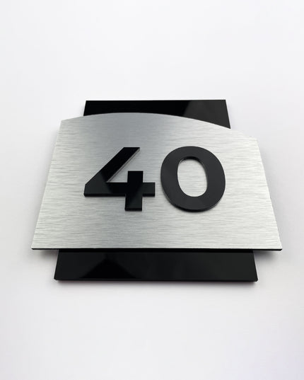 Modern interior door number sign with 3D design by ALUMADESIGNCO, elegant signage for hotel rooms, apartments, and residential interiors