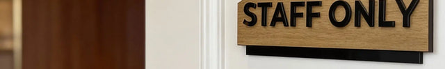 Premium interior door plaque by ALUMADESIGNCO featuring birch wood and black acrylic text, modern signage for workspaces, hospitality interiors, and homes