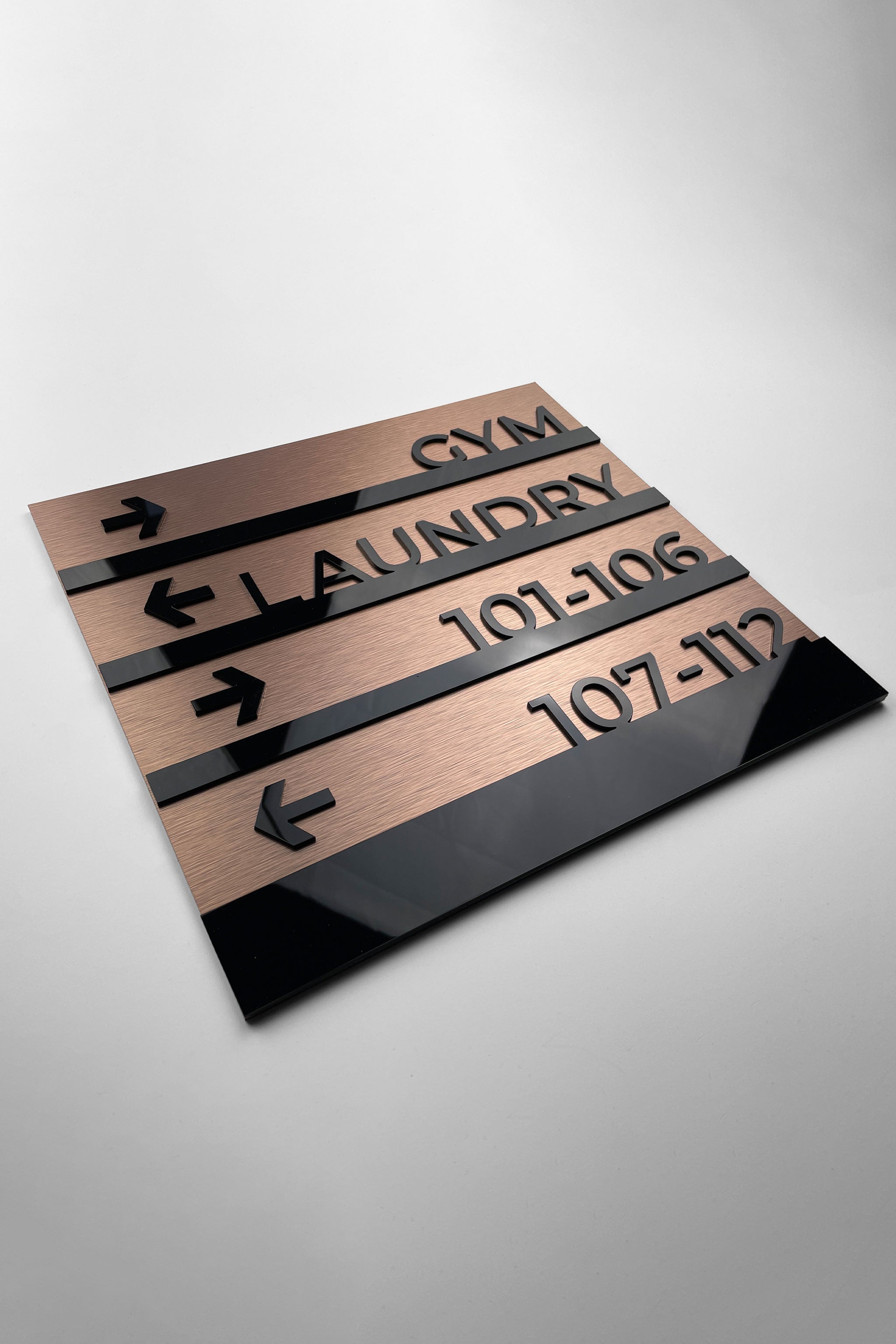 Premium Bronze Modern directional wall sign by ALUMADESIGNCO, stylish wayfinding signage for lobbies, hallways, offices, and hospitality interiors