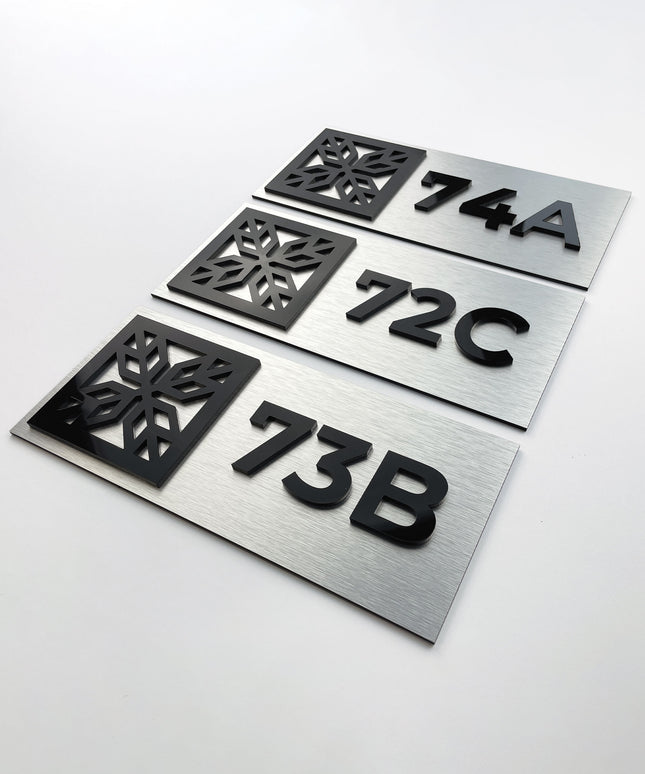 Modern brushed silver and acrylic glass suite room number sign by ALUMADESIGNCO, elegant door plaque for hotel suites and apartment interiors