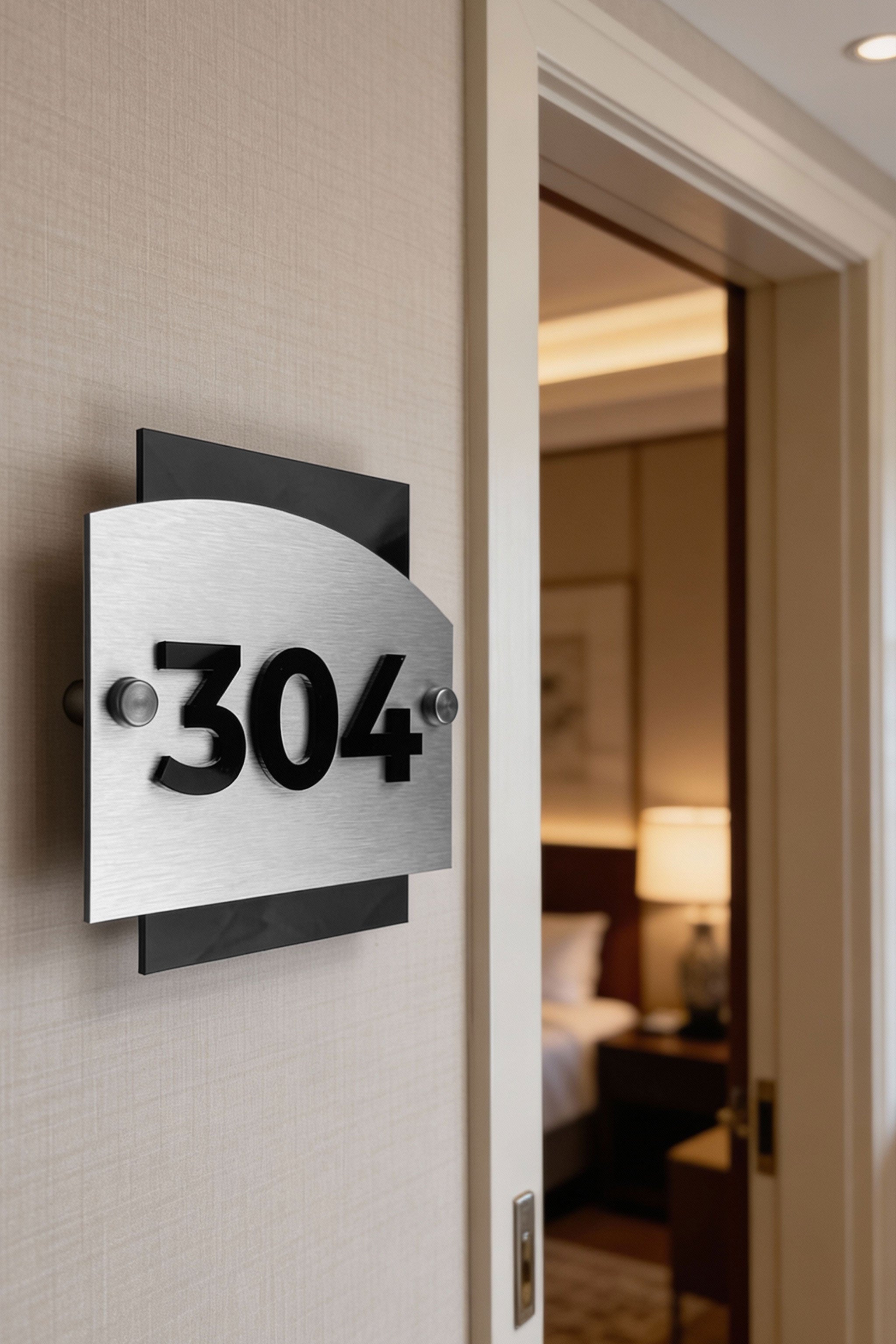 Modern Flow Design hotel door number sign by ALUMADESIGNCO combining brushed silver aluminum and raised acrylic numbers, elegant signage for hotel rooms and offices