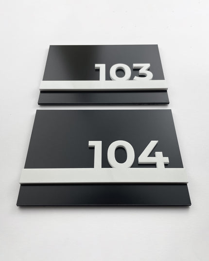 ALUMADESIGNCO black metal hotel door number plaque with white acrylic numbers, modern signage for boutique hotels, apartments, and office spaces