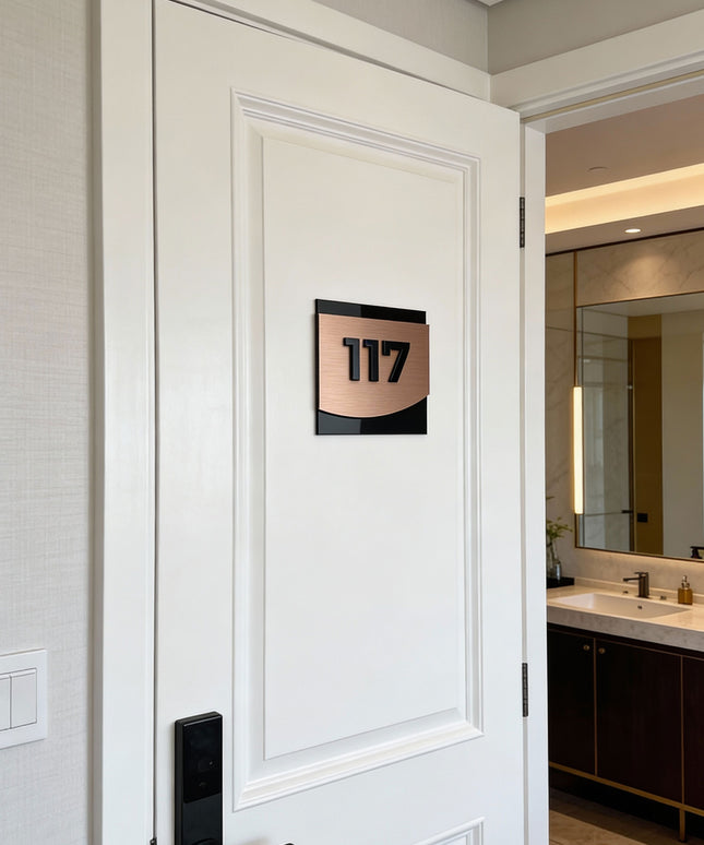ALUMADESIGNCO Flow Design bronze room number sign with minimalist modern style, premium door signage for boutique hotels and apartment buildings