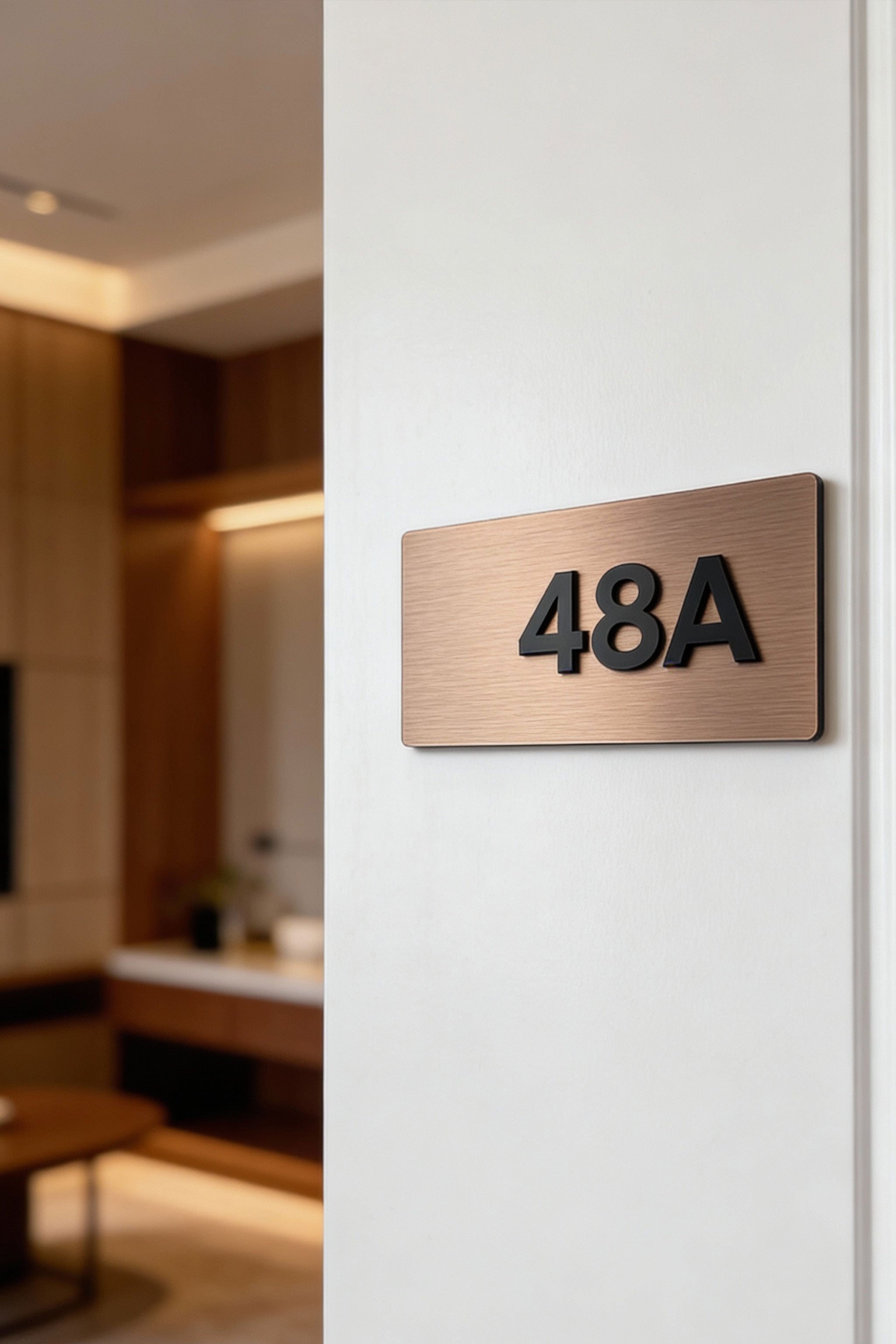 Modern Classic Design apartment number sign by ALUMADESIGNCO combining brushed bronze metal panel and acrylic numbers, stylish door signage for contemporary interiors