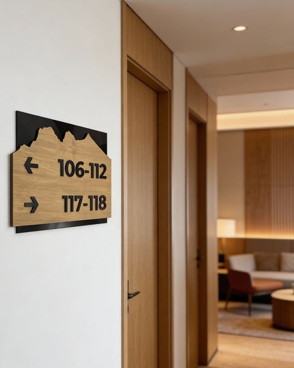 Premium Alpine directional wall sign by ALUMADESIGNCO featuring birch wood plate and black acrylic lettering, modern wayfinding signage for hospitality and office interiors