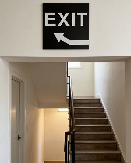Modern exit arrow sign upstairs by ALUMADESIGNCO featuring clean directional style, elegant interior signage for hotels, cafés, offices, and public interiors