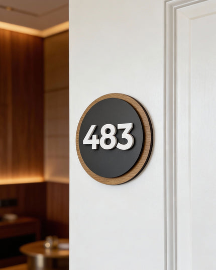 ALUMADESIGNCO Round Design wood and acrylic room number sign with natural birch plywood base and black acrylic numbers, modern Scandinavian hotel and apartment door number plaque