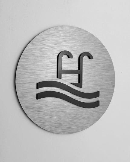 Modern pool area sign by ALUMADESIGNCO featuring clean elegant style, directional signage for hospitality spaces, wellness areas, and public interiors