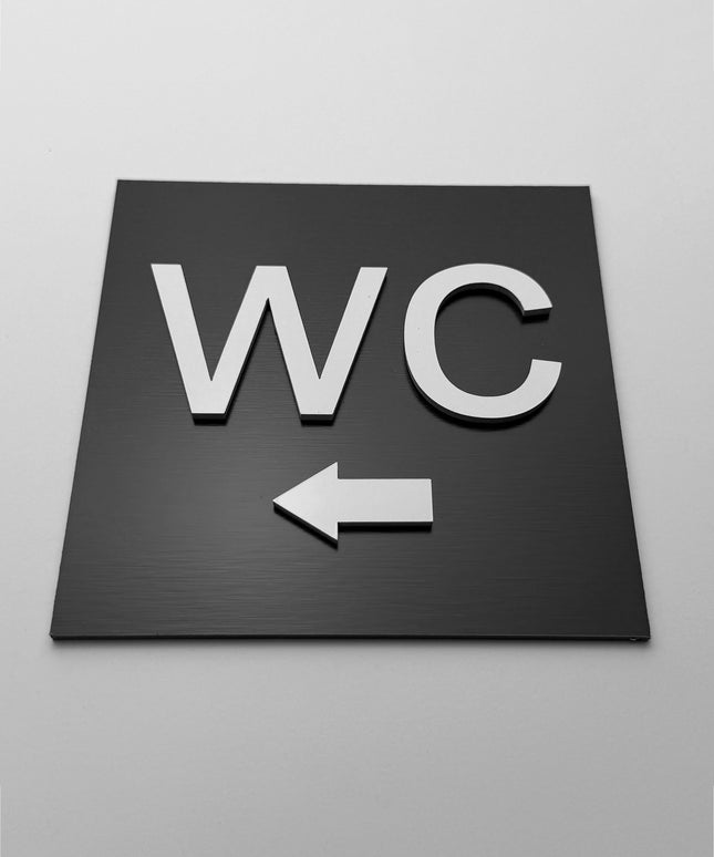ALUMADESIGNCO toilet direction sign for doors and walls with left arrow, premium restroom wayfinding signage for offices, hotels, apartments, and commercial spaces