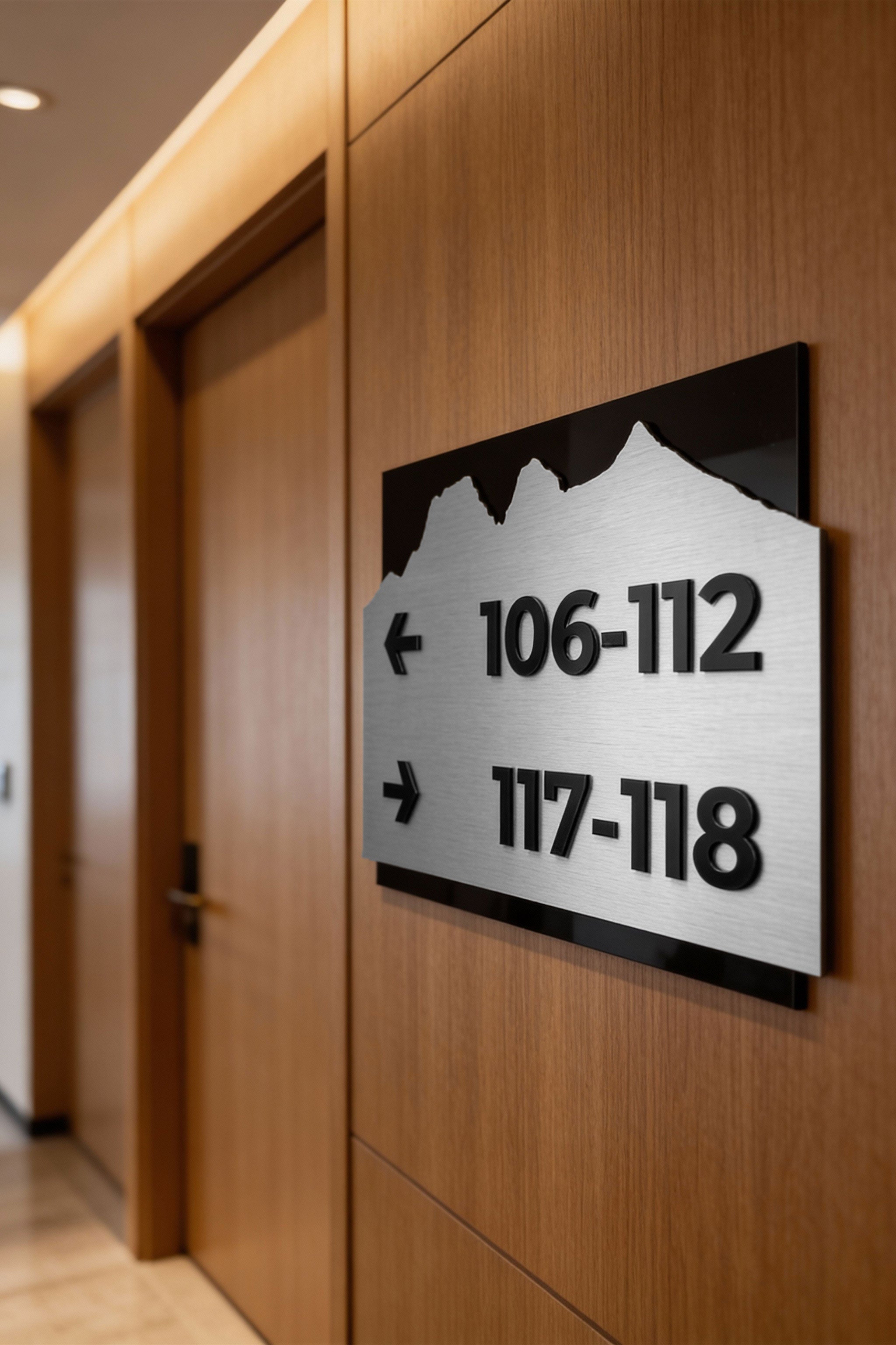 ALUMADESIGNCO directional wayfinding sign with brushed silver plaque and black acrylic text, modern signage for offices, hotels, apartments, and commercial interiors