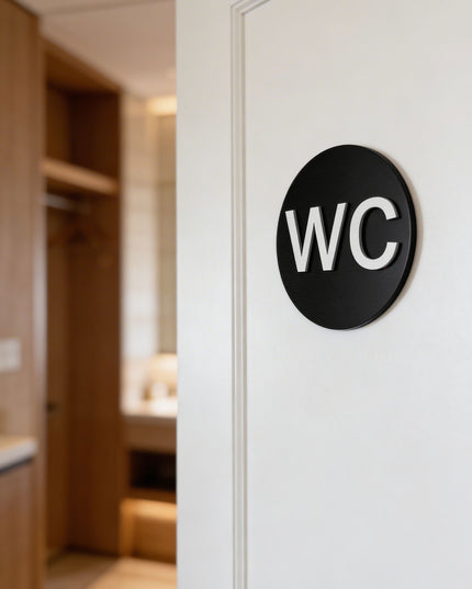 Modern WC bathroom sign by ALUMADESIGNCO featuring clean durable style, elegant restroom signage for hotels, cafés, offices, and public interiors