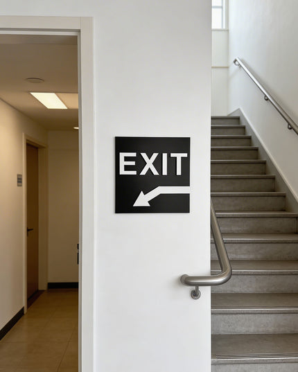 ALUMADESIGNCO exit sign for doors and walls with down left arrow, premium wayfinding signage for offices, hotels, apartments, and commercial spaces