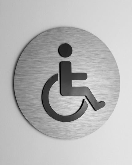 ALUMADESIGNCO accessible bathroom door sign with minimalist modern style and wheelchair symbol, signage for offices, hotels, cafés, and contemporary interiors