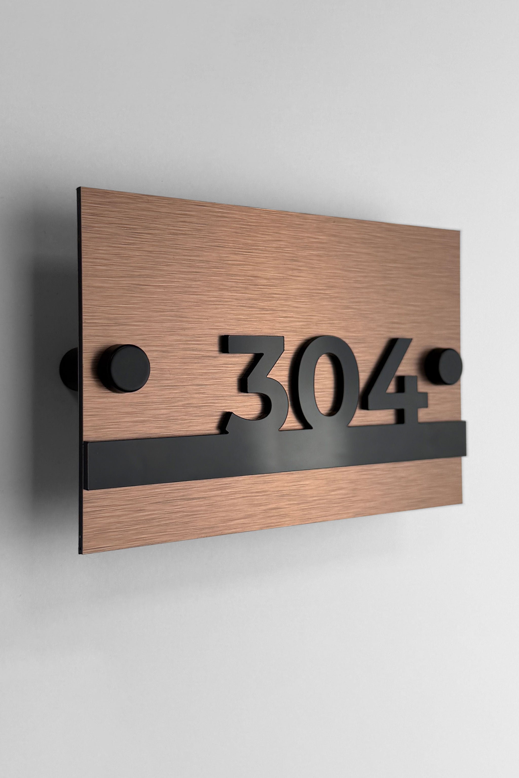 Brushed bronze and acrylic standoff apartment number sign Horizon Design by ALUMADESIGNCO with modern minimalist style, premium door number plaque for apartments and hotel corridors