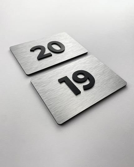 Premium room number sign for doors by ALUMADESIGNCO featuring brushed silver plaque and acrylic numbers, elegant door signage for hotels and offices