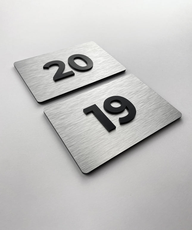 Premium room number sign for doors by ALUMADESIGNCO featuring brushed silver plaque and acrylic numbers, elegant door signage for hotels and offices