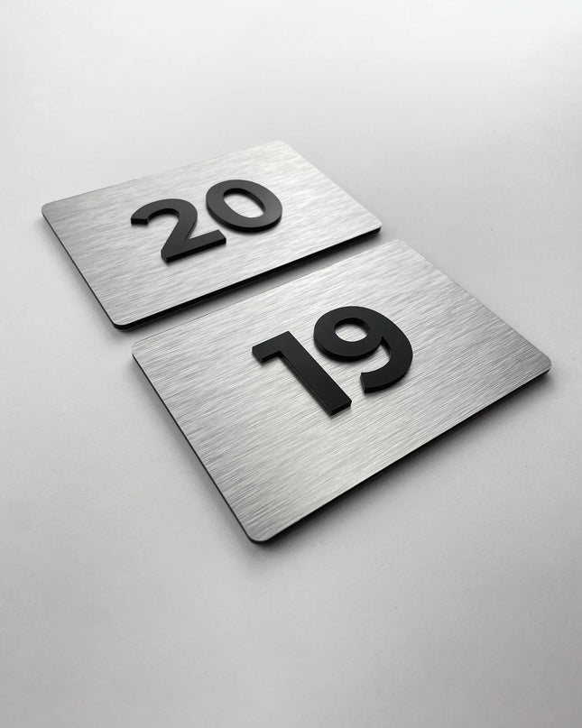 Premium room number sign for doors by ALUMADESIGNCO featuring brushed silver plaque and acrylic numbers, elegant door signage for hotels and offices