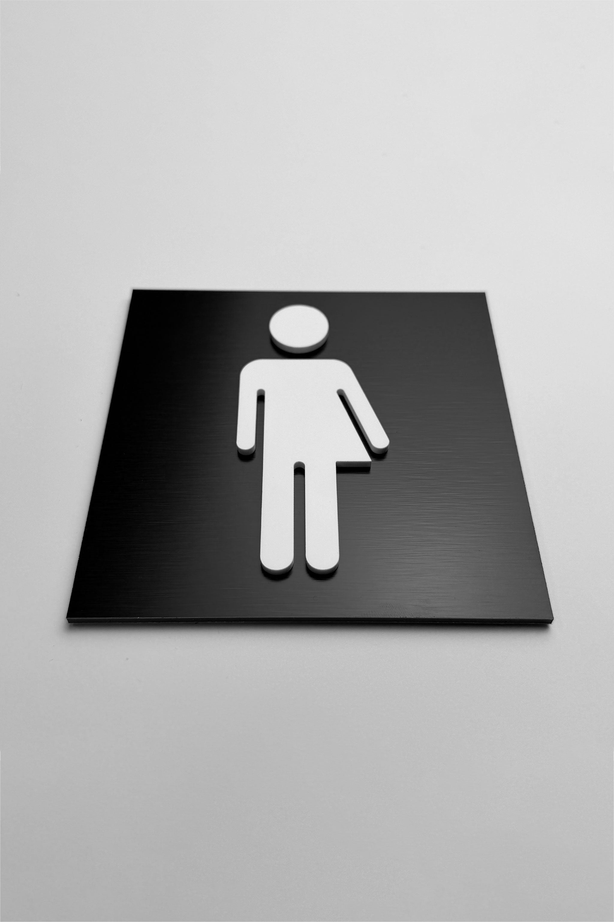 Modern gender neutral bathroom sign by ALUMADESIGNCO featuring clean inclusive design, elegant restroom signage for hotels, cafés, offices, and public interiors