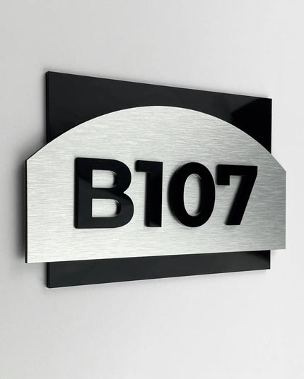 Brushed silver apartment number sign with black acrylic numerals