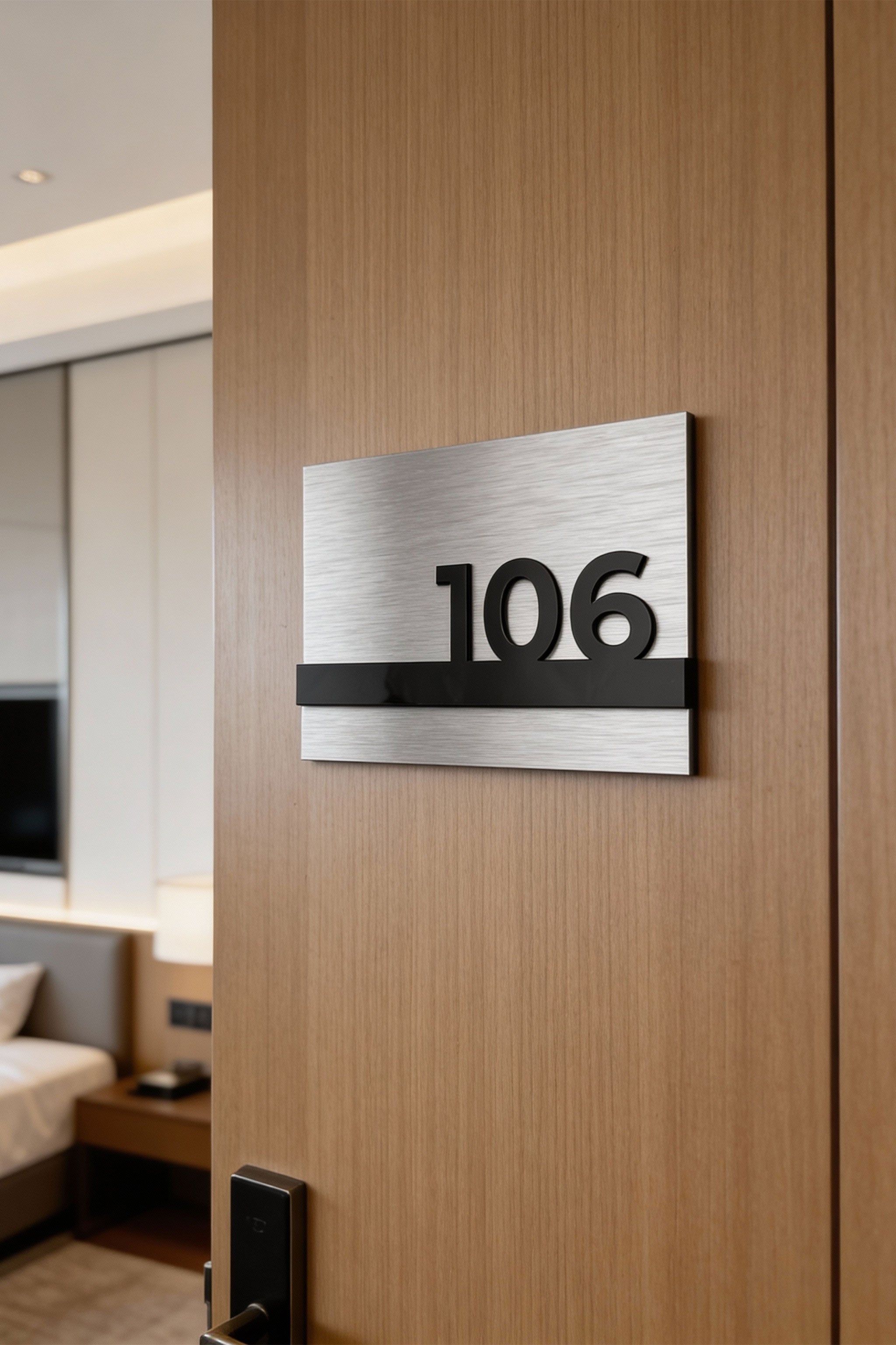 ALUMADESIGNCO custom silver metal and black acrylic room number sign with minimalist modern design, premium signage for boutique hotels and apartment buildings