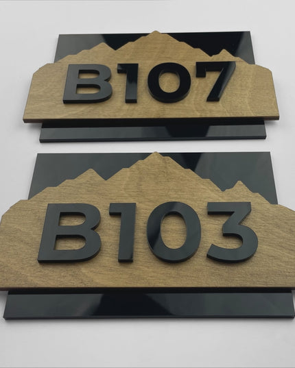 ALUMADESIGNCO Alpine Design wood and acrylic hotel room number sign featuring natural birch plywood and black acrylic numbers, minimalist Scandinavian door signage for contemporary hotel interiors
