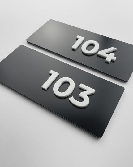 ALUMADESIGNCO black metal suite door number plaque with white acrylic numbers, premium signage for hotels, offices, and residential buildings