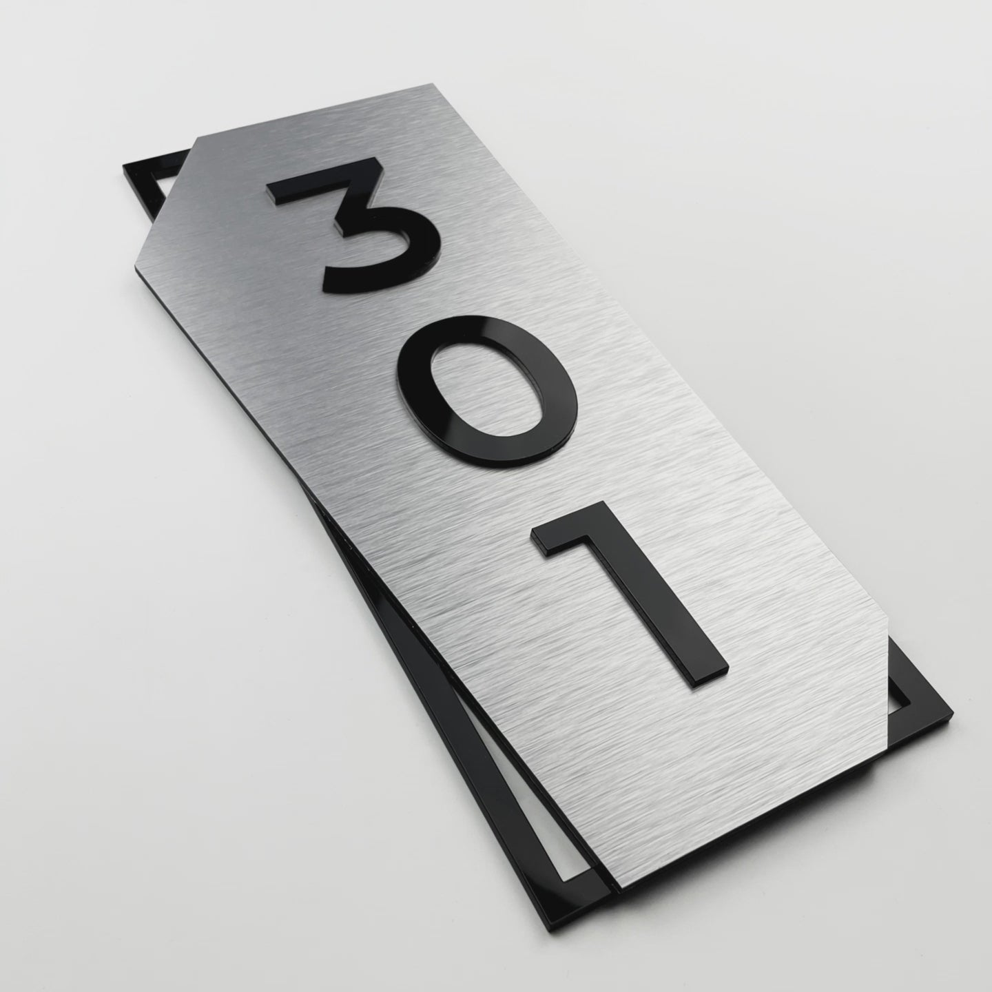 Premium vertical brushed silver and black acrylic glass door number sign by ALUMADESIGNCO, stylish signage for hotel rooms and apartment doors