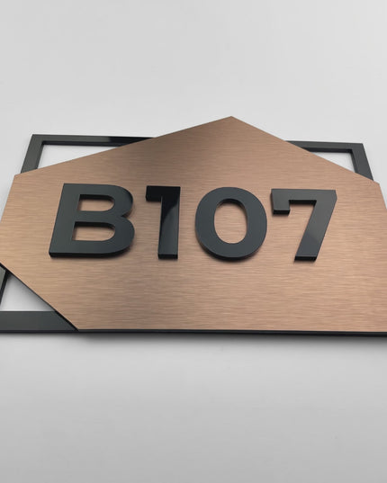 Premium brushed bronze hotel door number sign by ALUMADESIGNCO with acrylic glass numbers, stylish signage for hotel rooms and apartment buildings