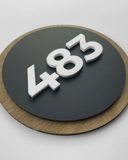 ALUMADESIGNCO wood and acrylic room number sign Round Design featuring birch plywood background and raised black acrylic numbers, minimalist Scandinavian door signage