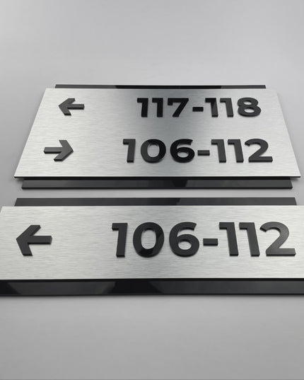 ALUMADESIGNCO Modern Design directional sign with brushed silver metal panel and black acrylic lettering, stylish signage for offices, hotels, and public interiors