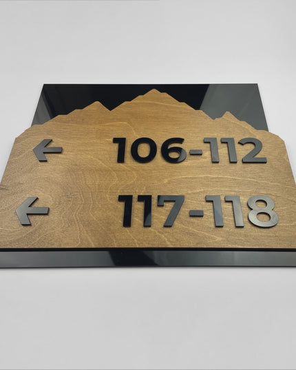 ALUMADESIGNCO Alpine directional wall sign with natural birch wood base and black acrylic lettering, stylish signage for offices, hospitality spaces, apartment buildings, and interiors