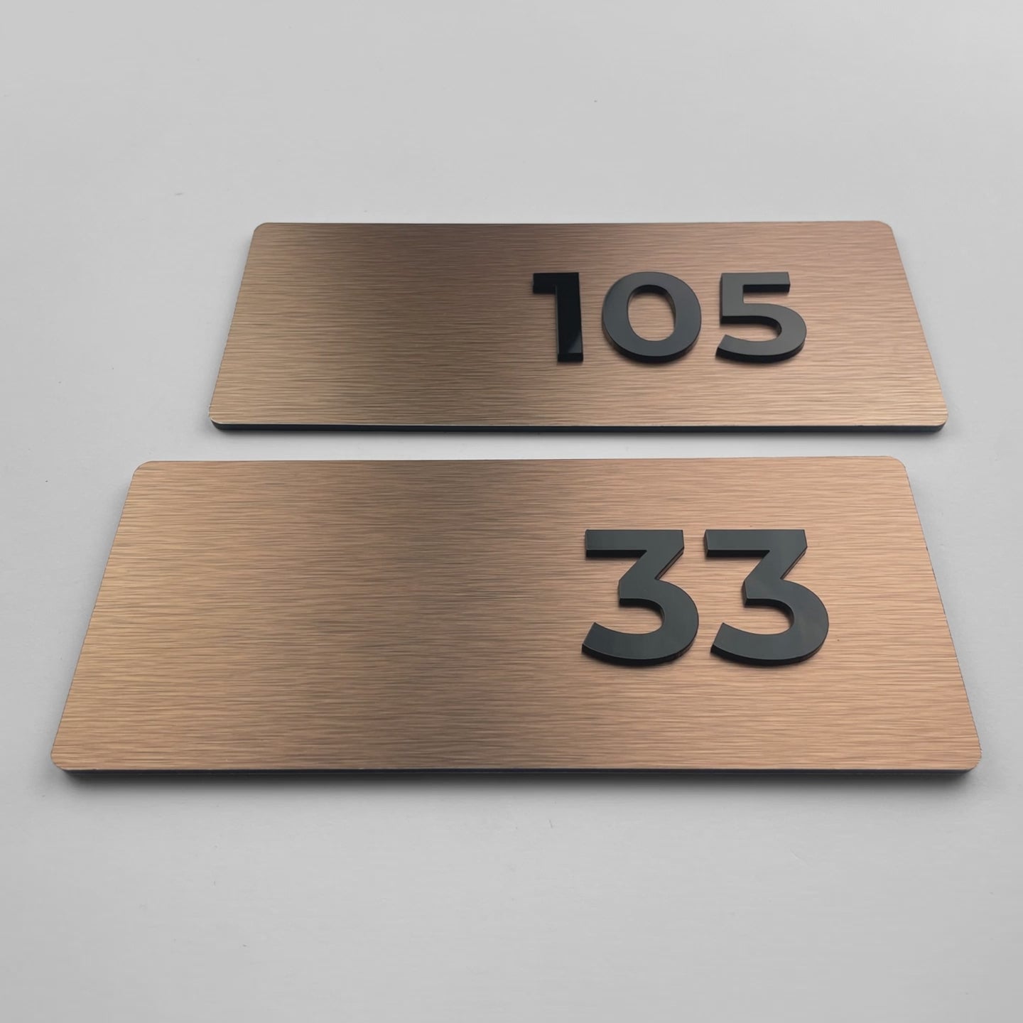 ALUMADESIGNCO Classic brushed bronze apartment door number plaque with acrylic numbers, modern signage for residential buildings, offices, and hospitality interiors