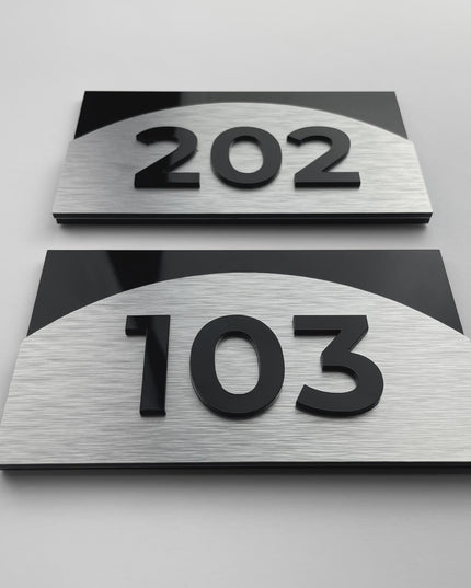 Premium Flow apartment number sign by ALUMADESIGNCO featuring brushed silver aluminum and raised acrylic numbers, stylish door signage for apartments and offices