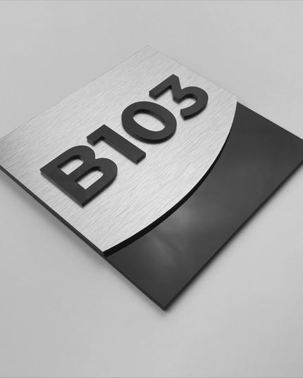 Modern luxury hotel room number sign by ALUMADESIGNCO combining brushed silver metal panel and acrylic numbers, stylish door signage for contemporary interiors