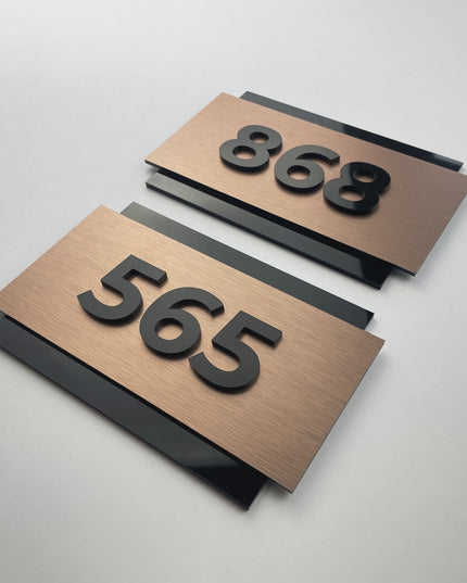ALUMADESIGNCO brushed bronze hotel room number plaque with 3D acrylic characters, elegant modern signage for hotels, Airbnb properties, and apartments