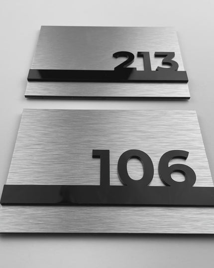 Horizon Design brushed silver and black acrylic glass room number sign by ALUMADESIGNCO featuring modern minimalist style, elegant hotel door signage for corridors and apartments