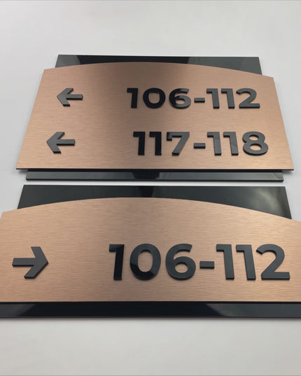 ALUMADESIGNCO Flow Design brushed bronze and acrylic interior wayfinding sign with elegant modern style, directional signage for offices, hotels, apartments, and contemporary interiors